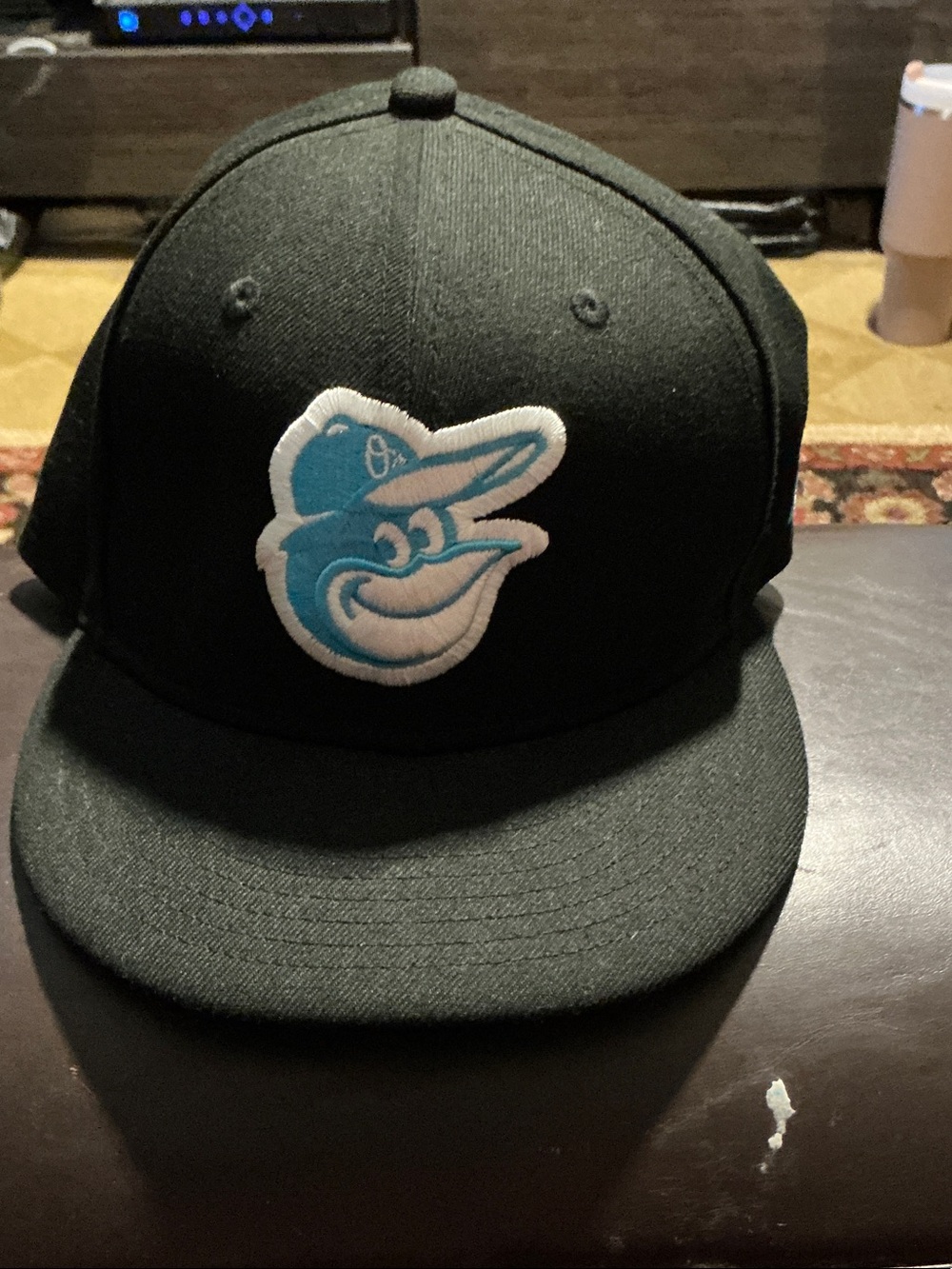 New Era Black Hat with Teal and White Baltimore Orioles Logo